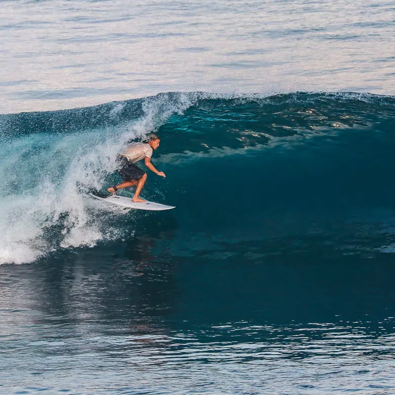 Surfer riding a barrel at Uluwatu.