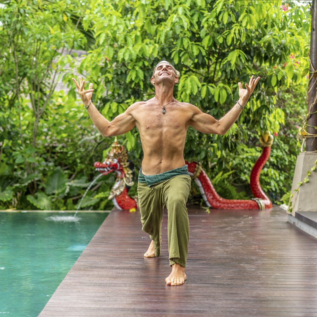 Oliver doing a mindfulness exercise by the pool.